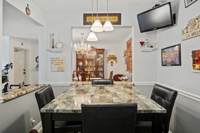 a dining room with furniture and window