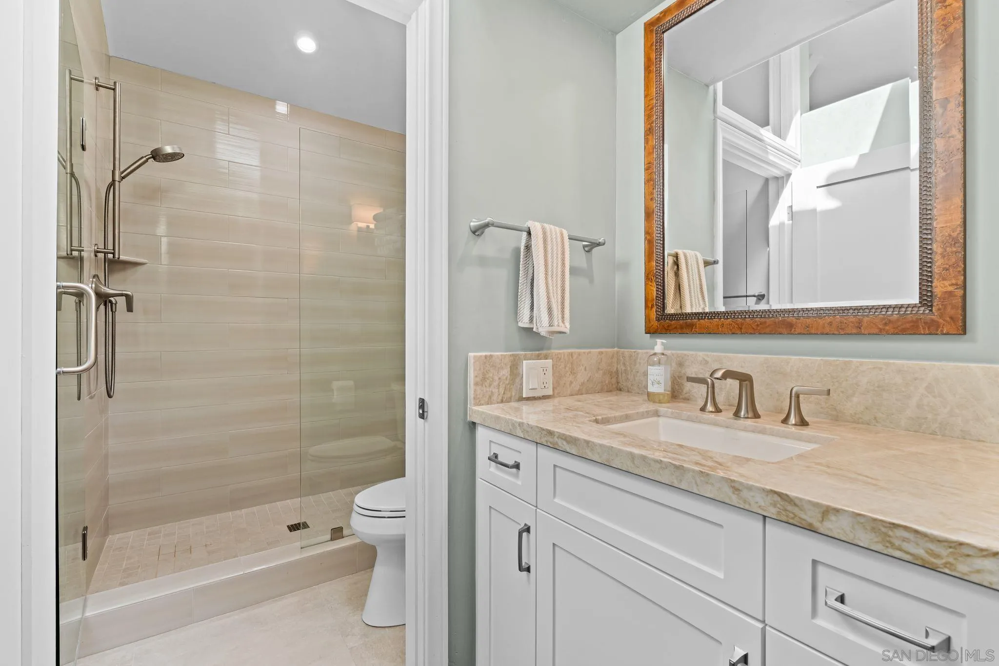 2969 Racetrack View Drive Del Mar, CA 92014 - Photo 56 of 59 a bathroom with a granite countertop sink a toilet and shower