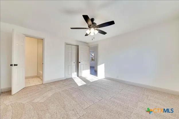 a view of an empty room and window