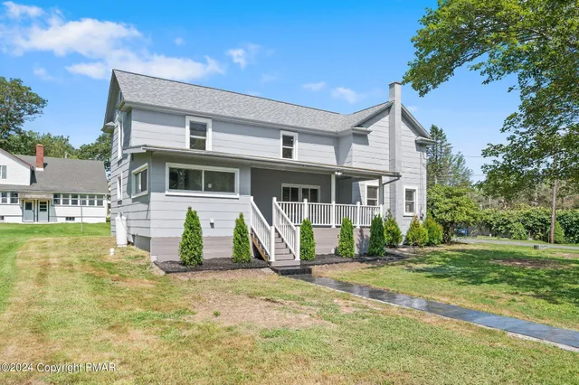 a view of a house with a swimming pool
