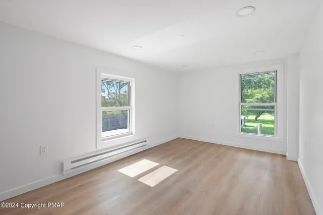 an empty room with windows