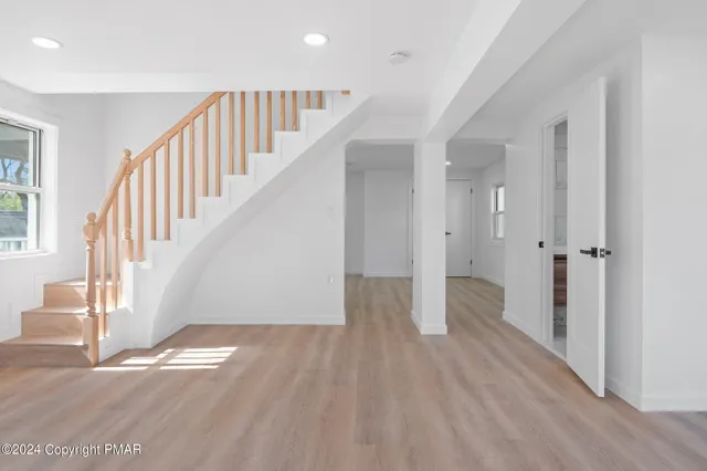a view of entryway with wooden floor