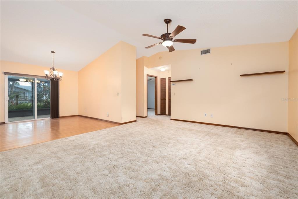 3221 Lime Tree Drive Edgewater, FL 32141 - Photo 11 of 28 a view of a livingroom with a ceiling fan and window