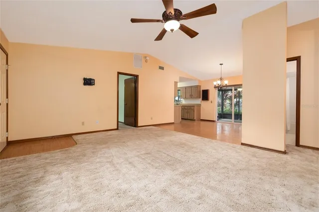 a view of a kitchen with a sink and a refrigerator