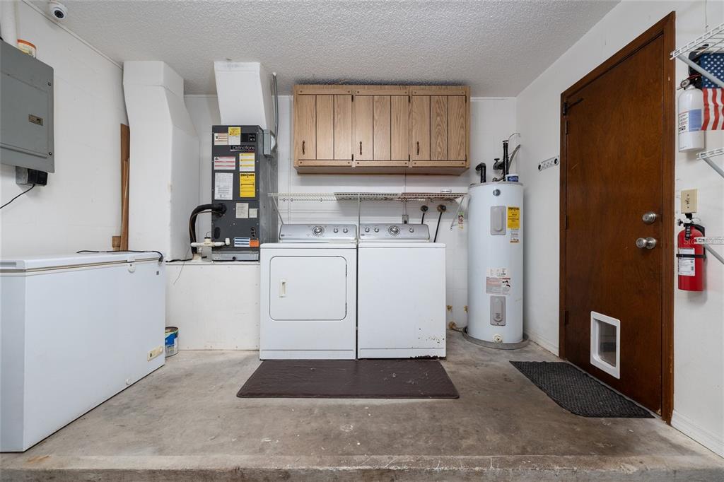 3221 Lime Tree Drive Edgewater, FL 32141 - Photo 22 of 29 a kitchen with a refrigerator a stove a sink a washer and dryer