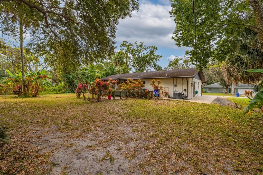 3221 Lime Tree Drive Edgewater, FL 32141 - Photo 4 of 29 a view of a house with garden and sitting area