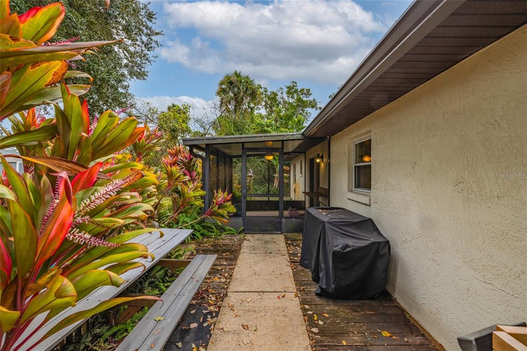 3221 Lime Tree Drive Edgewater, FL 32141 - Photo 5 of 28 a front view of a house with garden