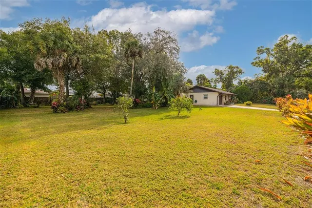 a view of a swimming pool with an outdoor space and seating area