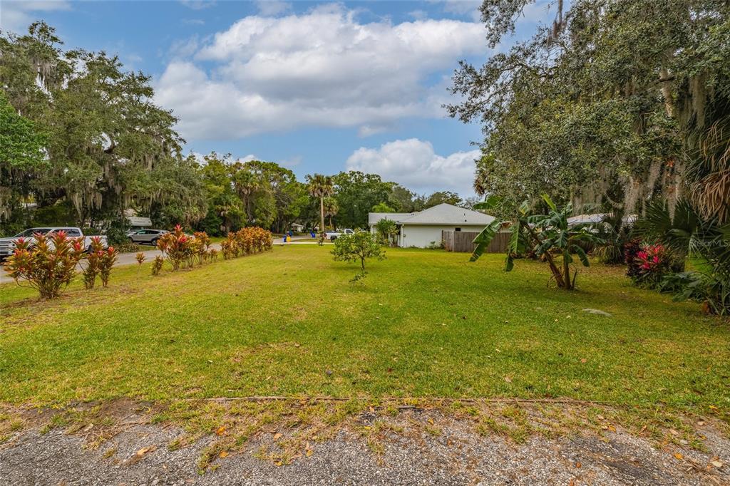 3221 Lime Tree Drive Edgewater, FL 32141 - Photo 7 of 28 a view of a house with a yard and lake view