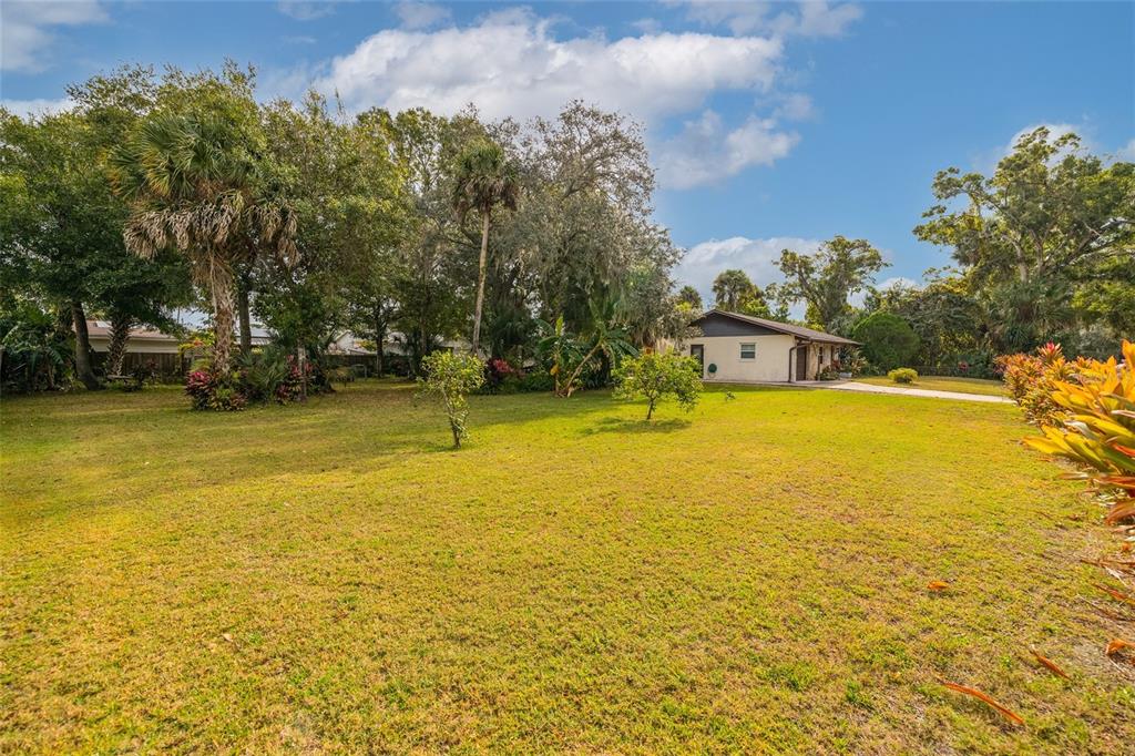 3221 Lime Tree Drive Edgewater, FL 32141 - Photo 9 of 28 a view of a swimming pool with an outdoor space and seating area