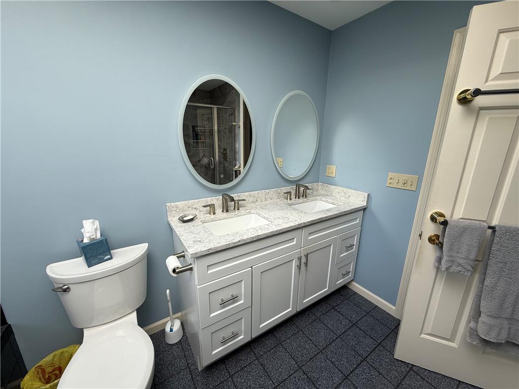 4114 Rochelle Drive Allentown, PA 18104 - Photo 31 of 35 Double vanity with stone counters and dual mirrors provide ample space.