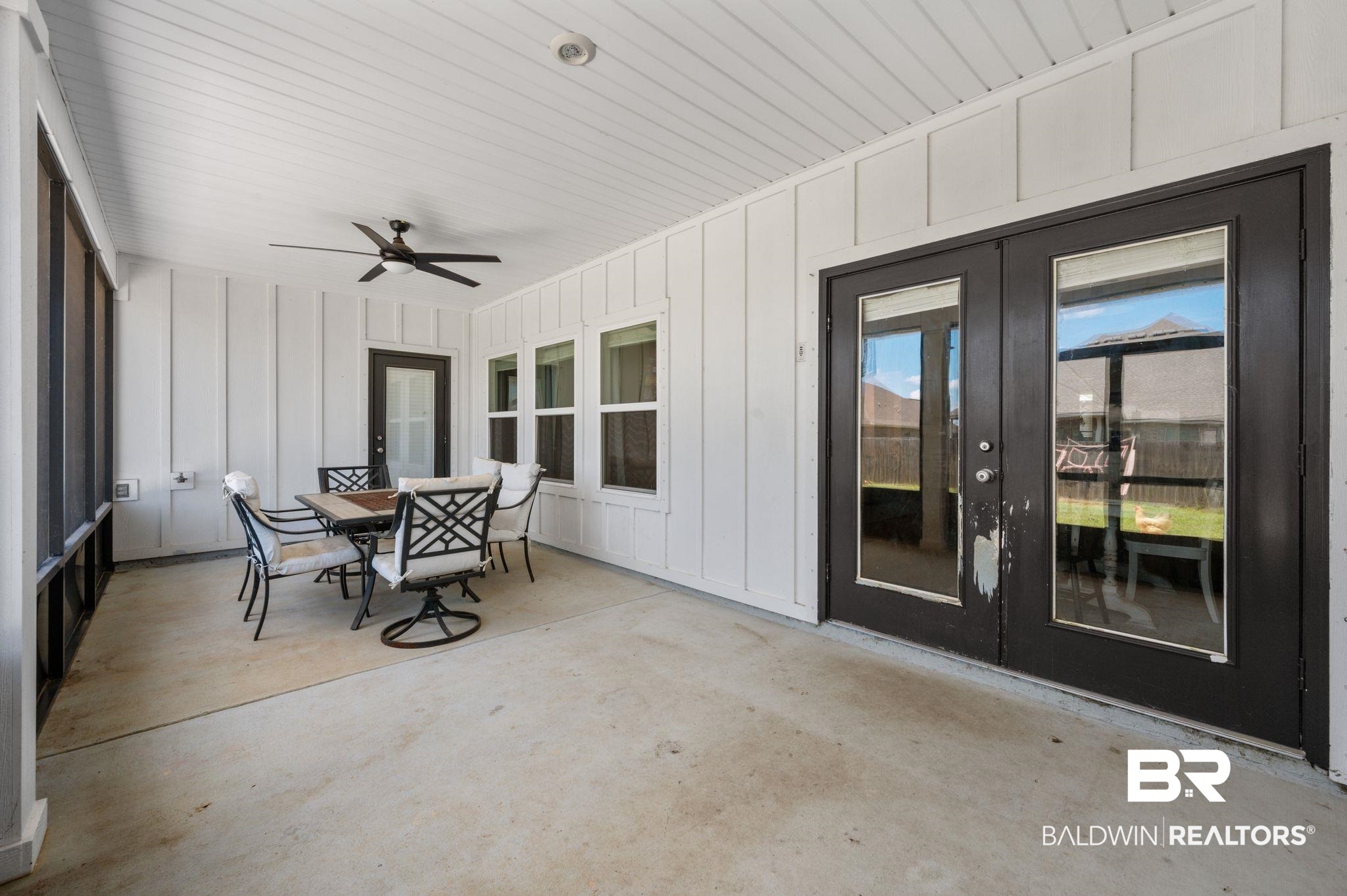 10169 Dunleith Loop Daphne, AL 36526 - Photo 13 of 40 Sunroom featuring french doors, a ceiling fan, and outdoor dining area