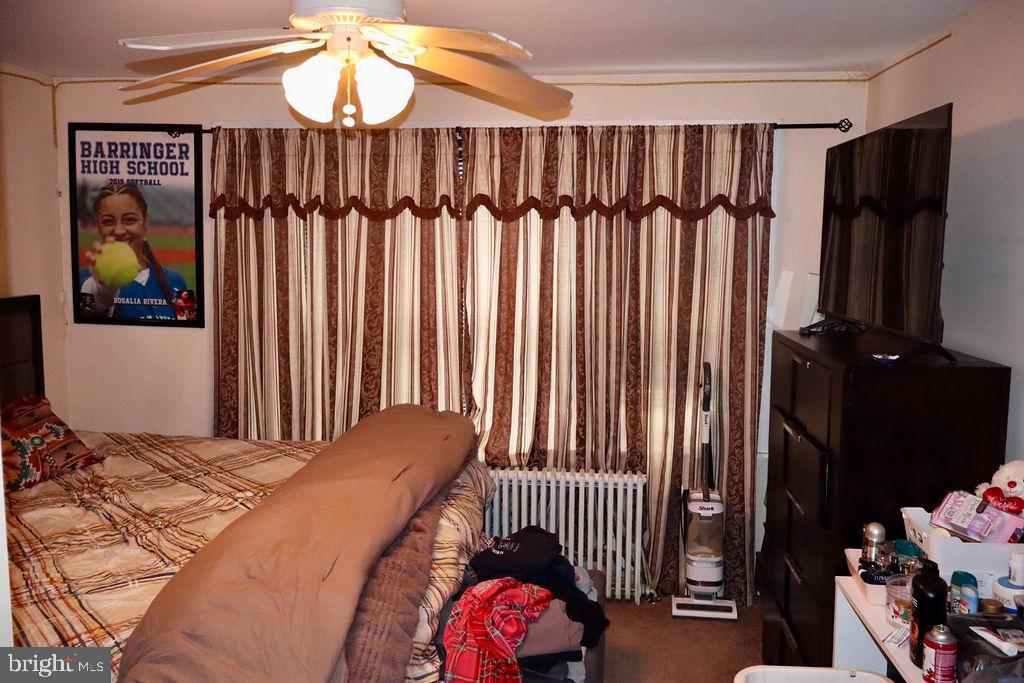 3420 Penn Avenue Sinking Spring, PA 19608 - Photo 12 of 34 a bedroom with a bed and a chandelier