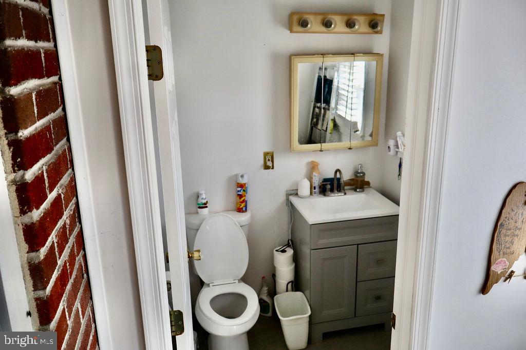 3420 Penn Avenue Sinking Spring, PA 19608 - Photo 15 of 34 a bathroom with a toilet sink and mirror