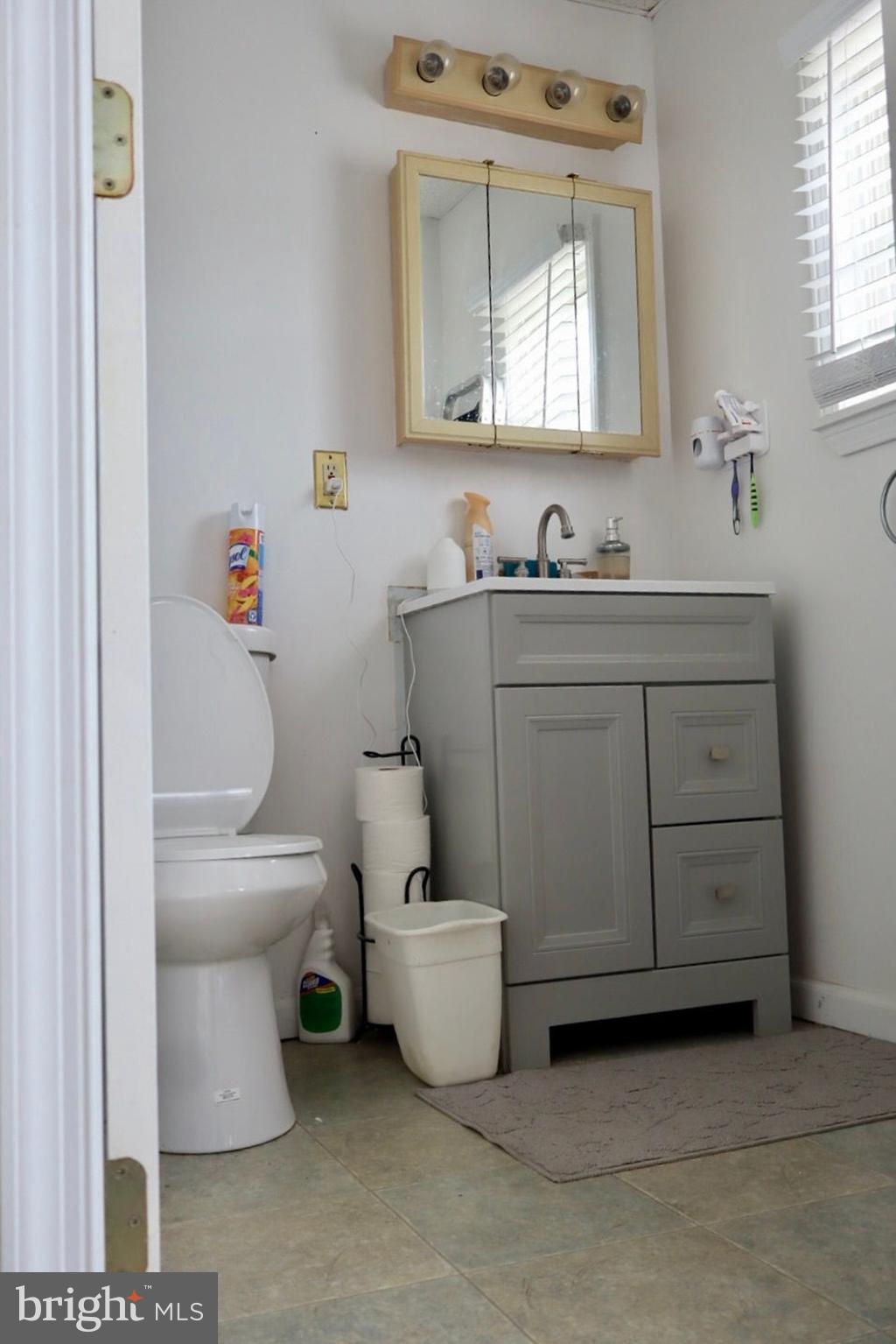 3420 Penn Avenue Sinking Spring, PA 19608 - Photo 6 of 34 a bathroom with a toilet sink and mirror