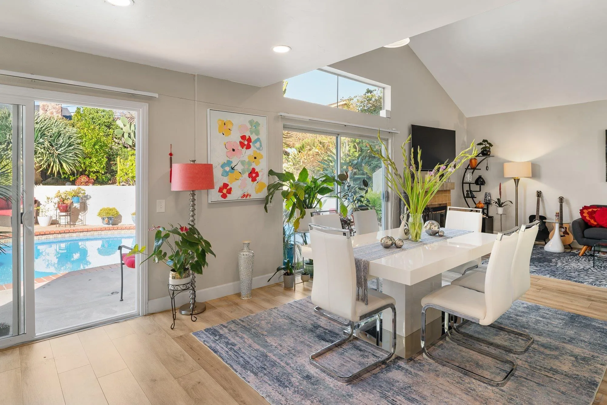 3598 Old Cobble Road San Diego, CA 92111 - Photo 12 of 42 a view of a dining room with furniture window and wooden floor