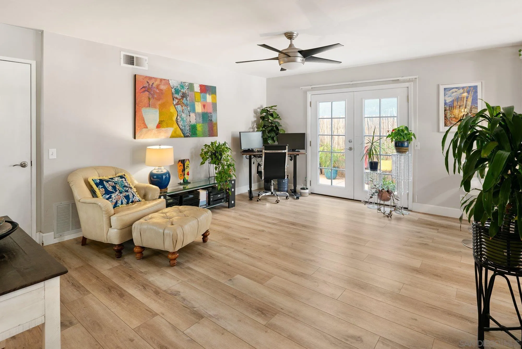 3598 Old Cobble Road San Diego, CA 92111 - Photo 20 of 42 a living room with furniture and a flat screen tv