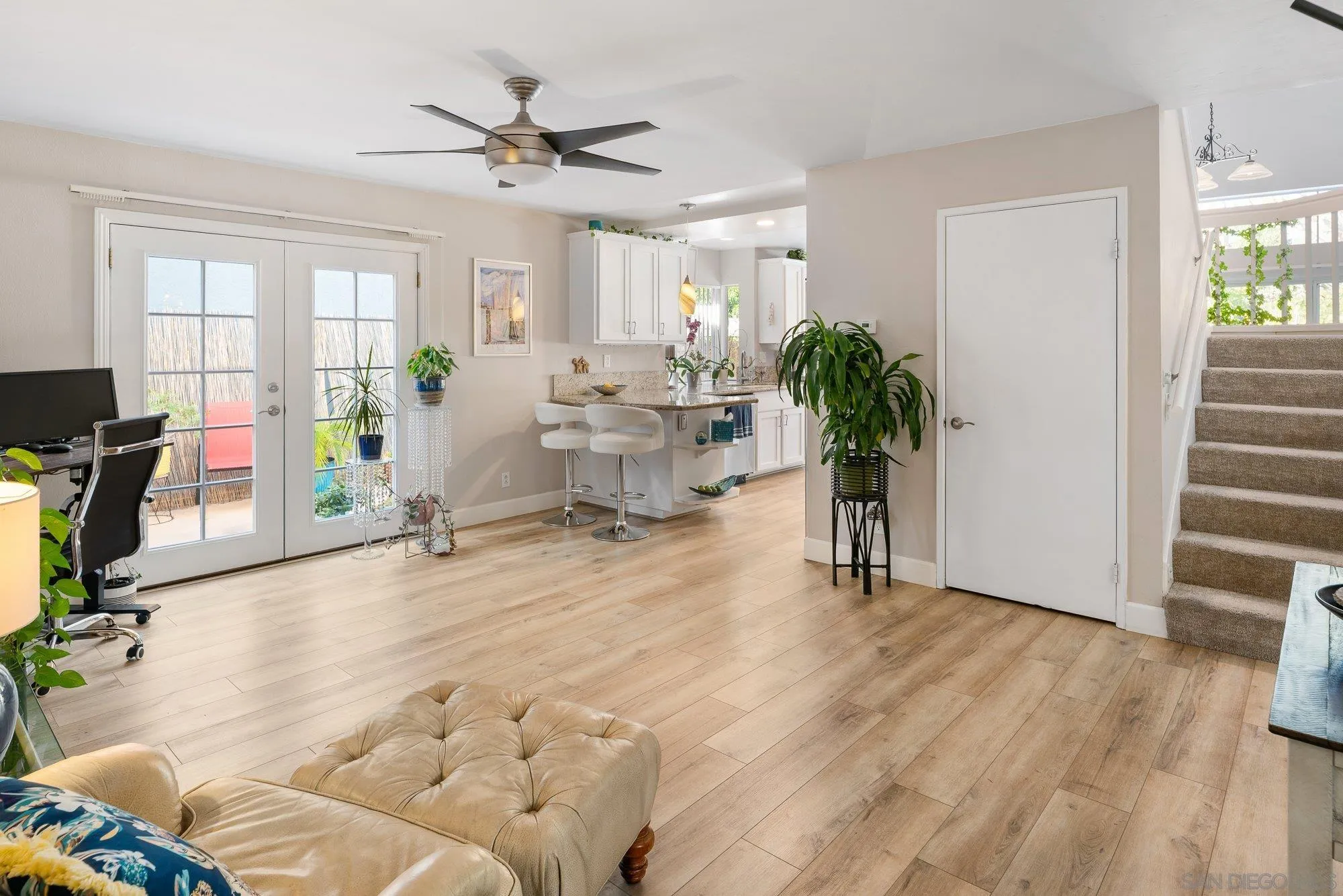 3598 Old Cobble Road San Diego, CA 92111 - Photo 21 of 42 a living room with furniture and wooden floor
