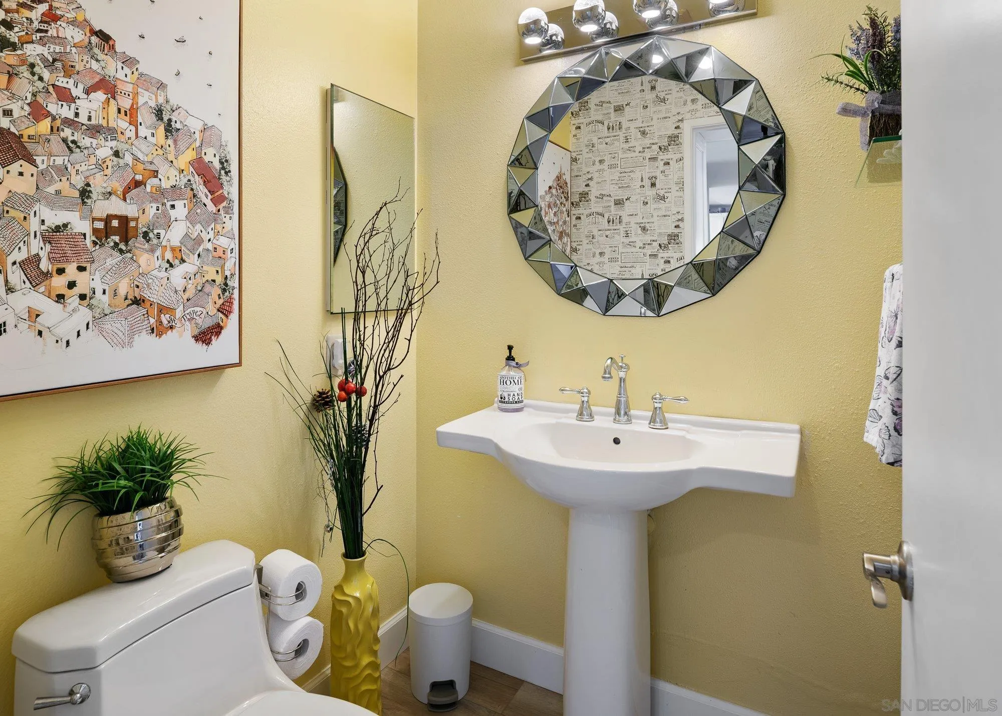 3598 Old Cobble Road San Diego, CA 92111 - Photo 23 of 42 a bathroom with a sink mirror and toilet