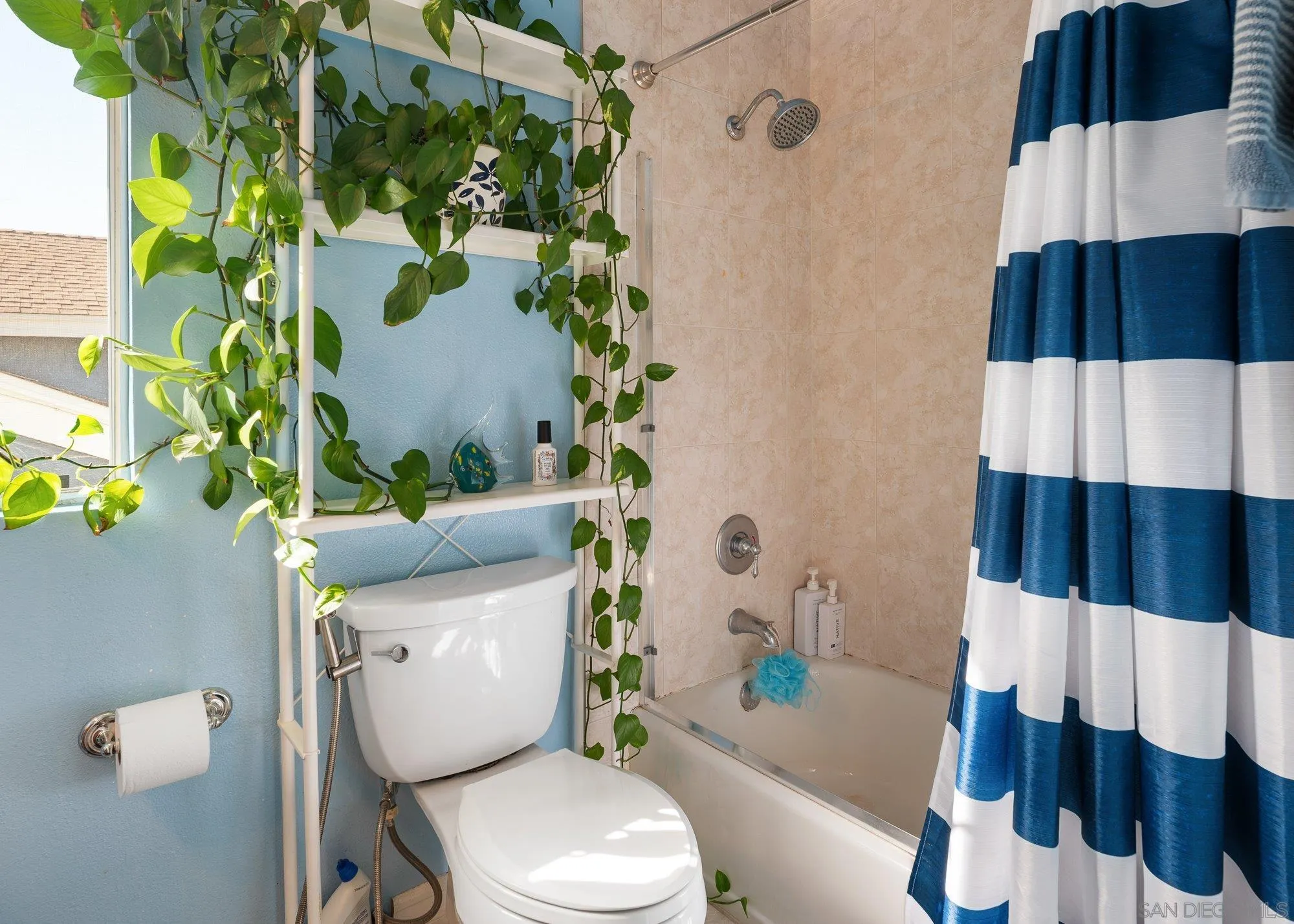 3598 Old Cobble Road San Diego, CA 92111 - Photo 31 of 42 a bathroom with a sink and toilet