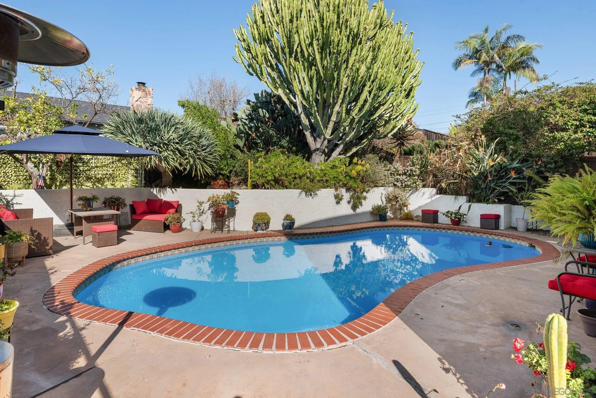 3598 Old Cobble Road San Diego, CA 92111 - Photo 34 of 42 a view of a swimming pool with an outdoor seating