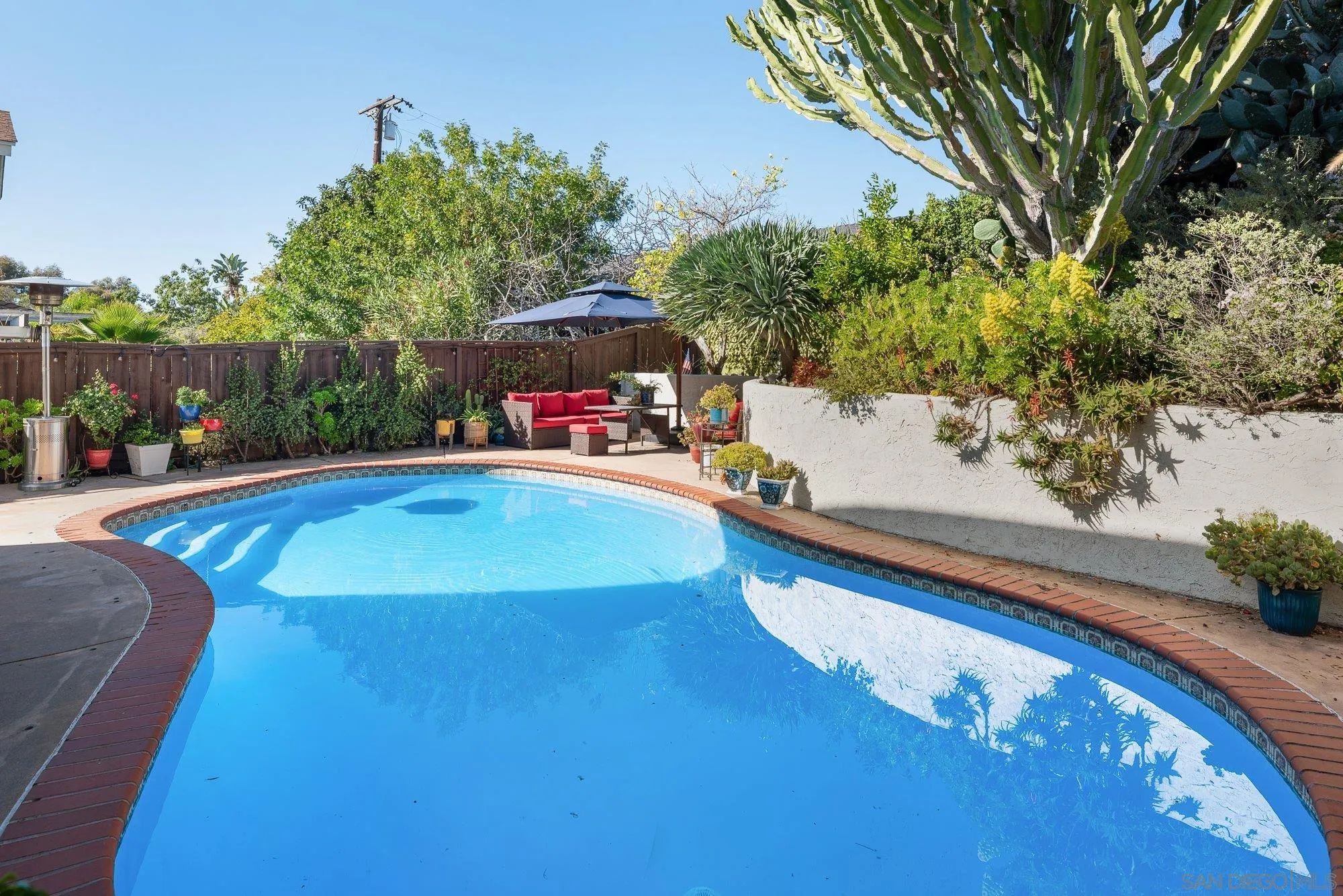 3598 Old Cobble Road San Diego, CA 92111 - Photo 36 of 42 a view of a swimming pool with a patio