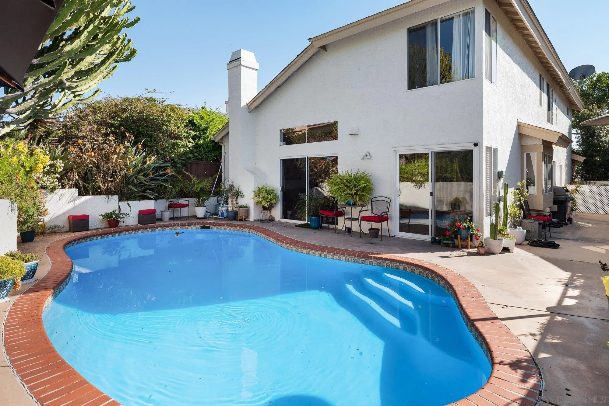 3598 Old Cobble Road San Diego, CA 92111 - Photo 37 of 42 a swimming pool with outdoor seating