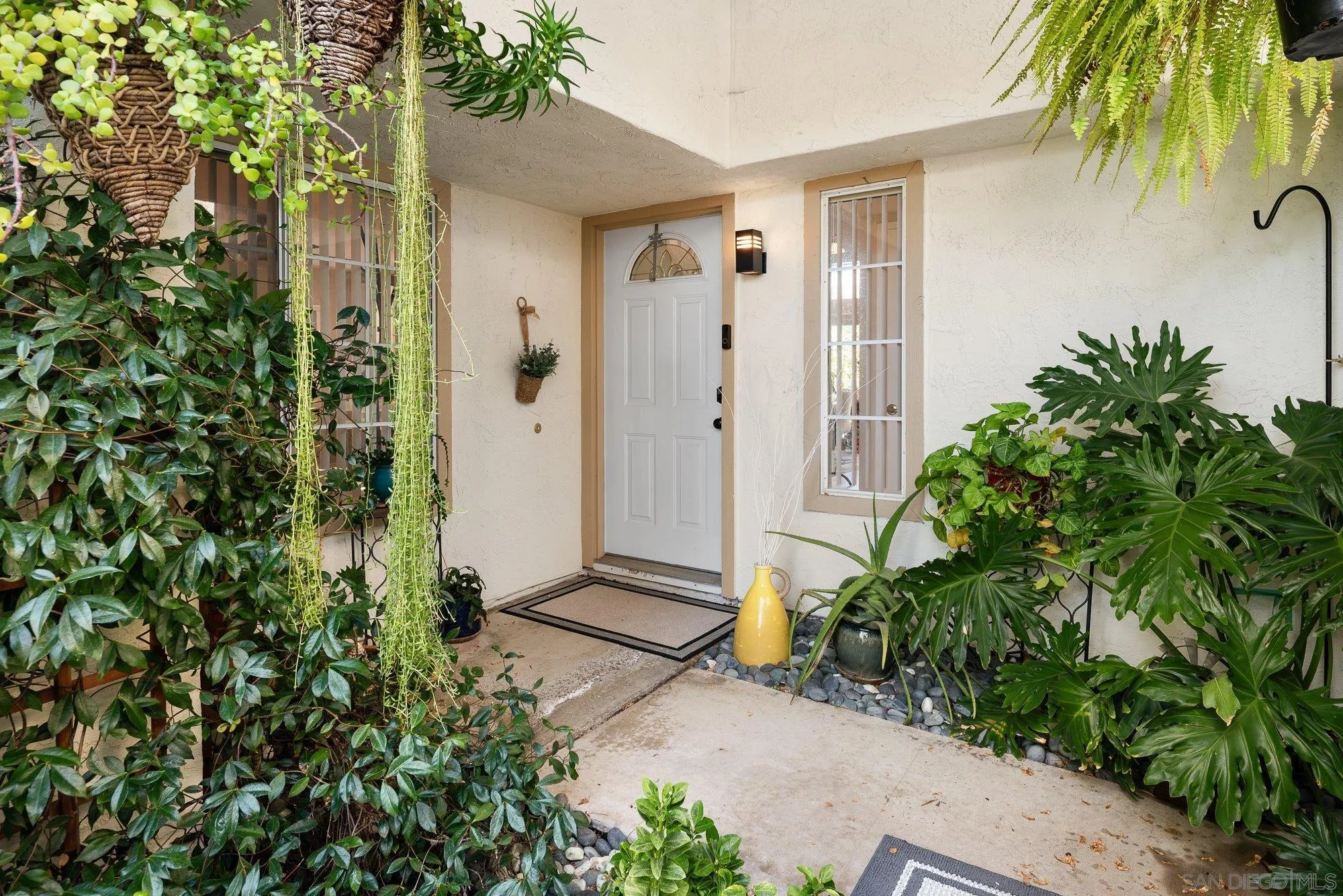 3598 Old Cobble Road San Diego, CA 92111 - Photo 4 of 42 a backyard of a house with a tree