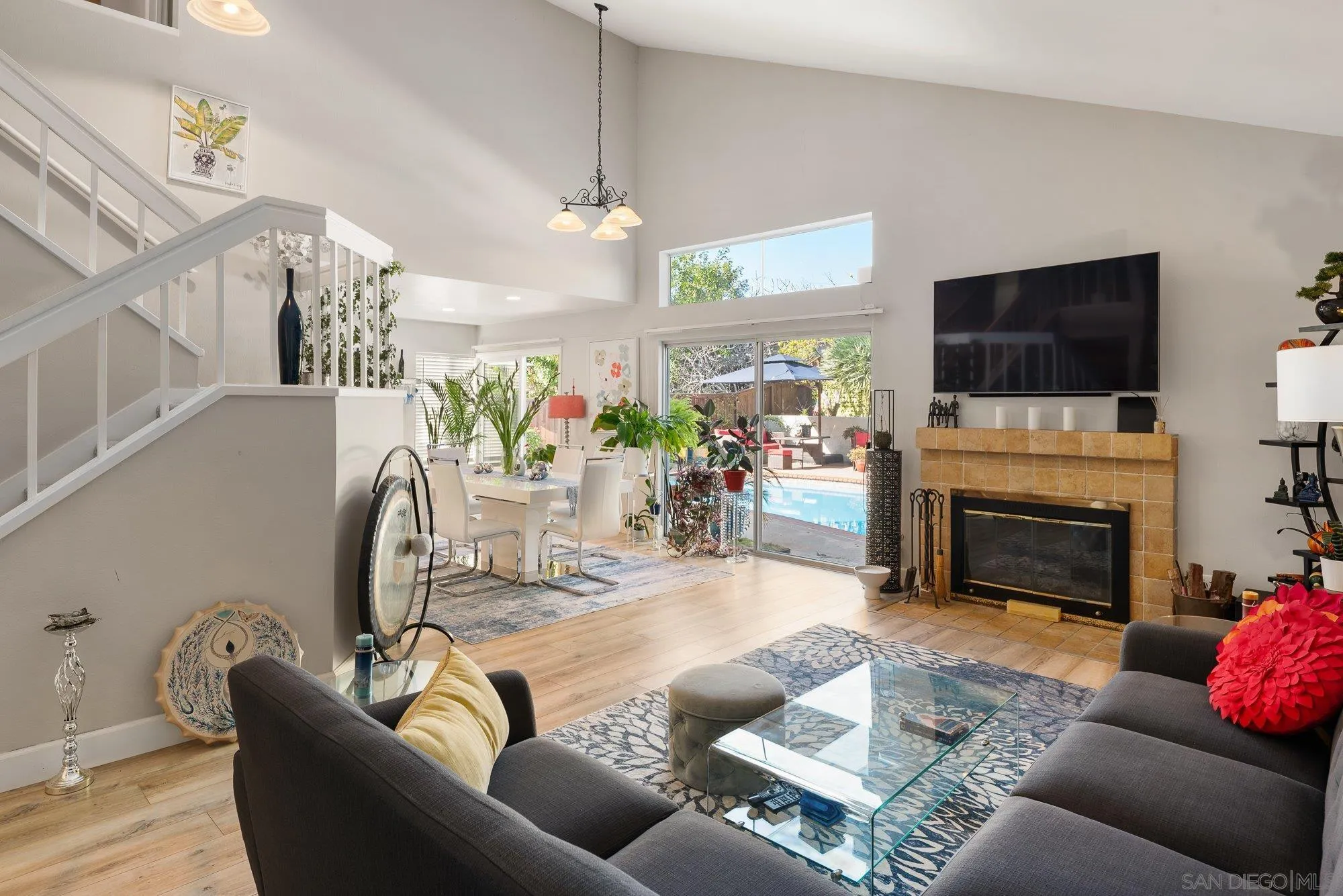 3598 Old Cobble Road San Diego, CA 92111 - Photo 7 of 42 a living room with furniture a fireplace and a flat screen tv