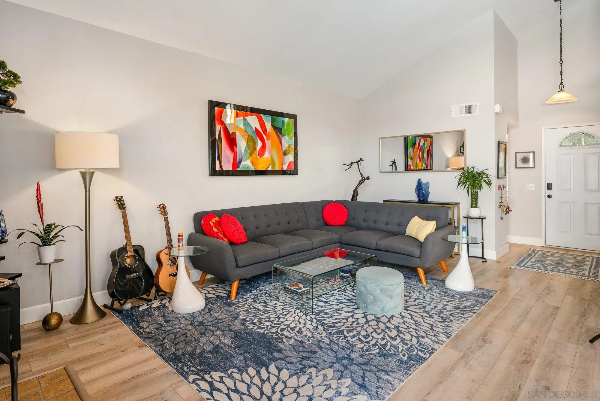 3598 Old Cobble Road San Diego, CA 92111 - Photo 8 of 42 a living room with furniture and a wooden floor