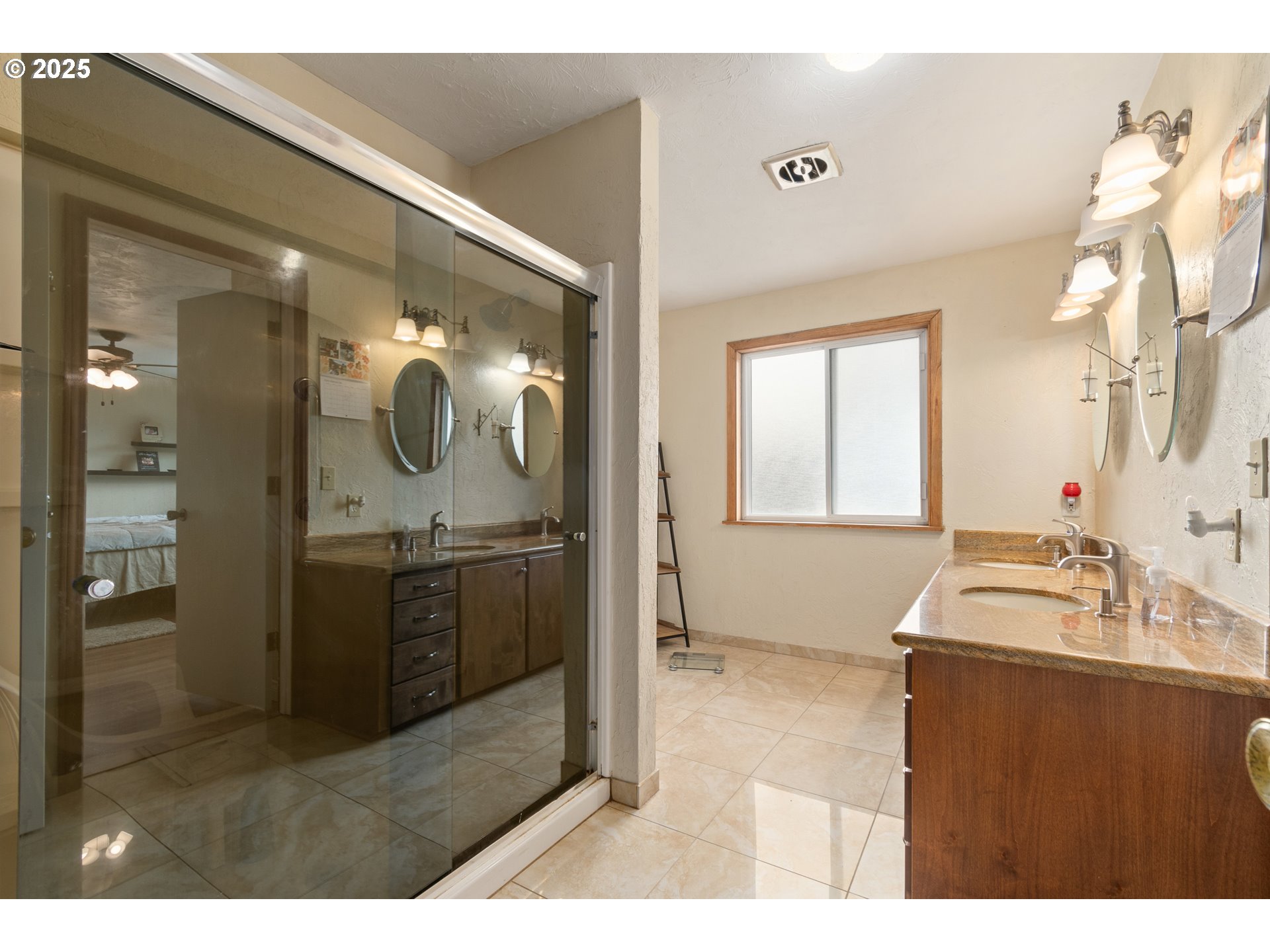 2746 Harlow Road Eugene, OR 97401 - Photo 15 of 22 a bathroom with a double vanity sink mirror and shower