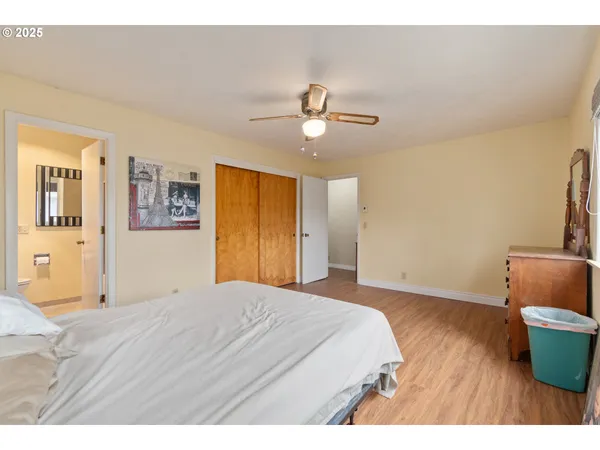 a bedroom with a bed and a couch