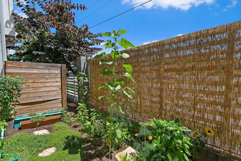 a view of a door and chair and table in the balcony