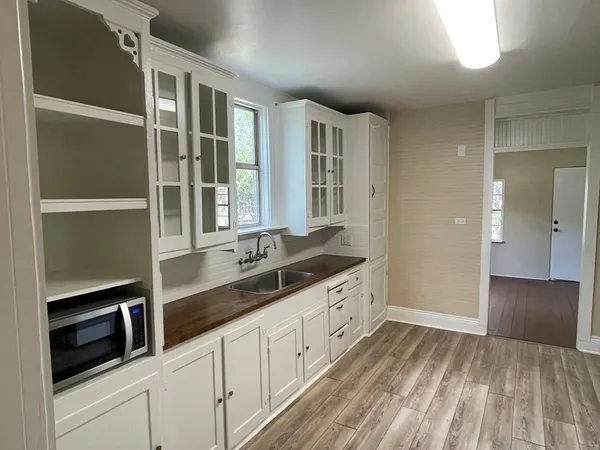 a spacious bathroom with double vanity and mirrors