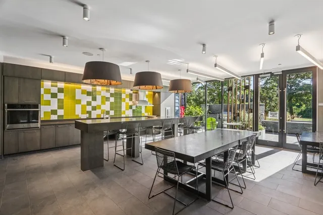 a view of a dining room with furniture window and outdoor kitchen