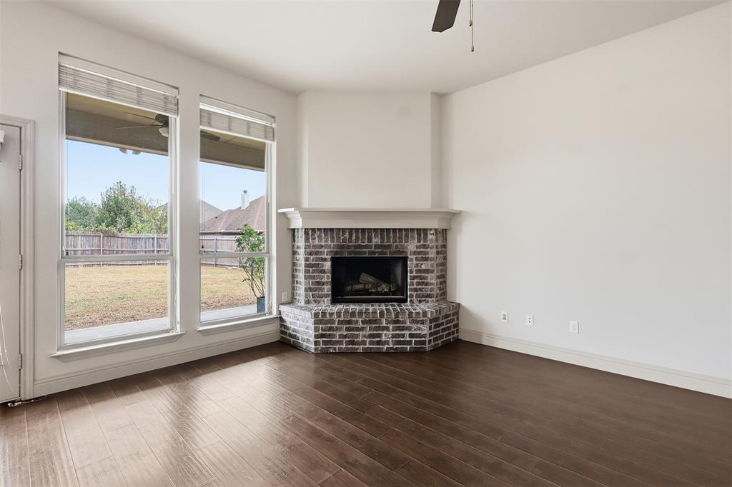 2512 Guinn Farms Road Tyler, TX 75707 - Photo 15 of 29 a view of empty room with wooden floor and fireplace
