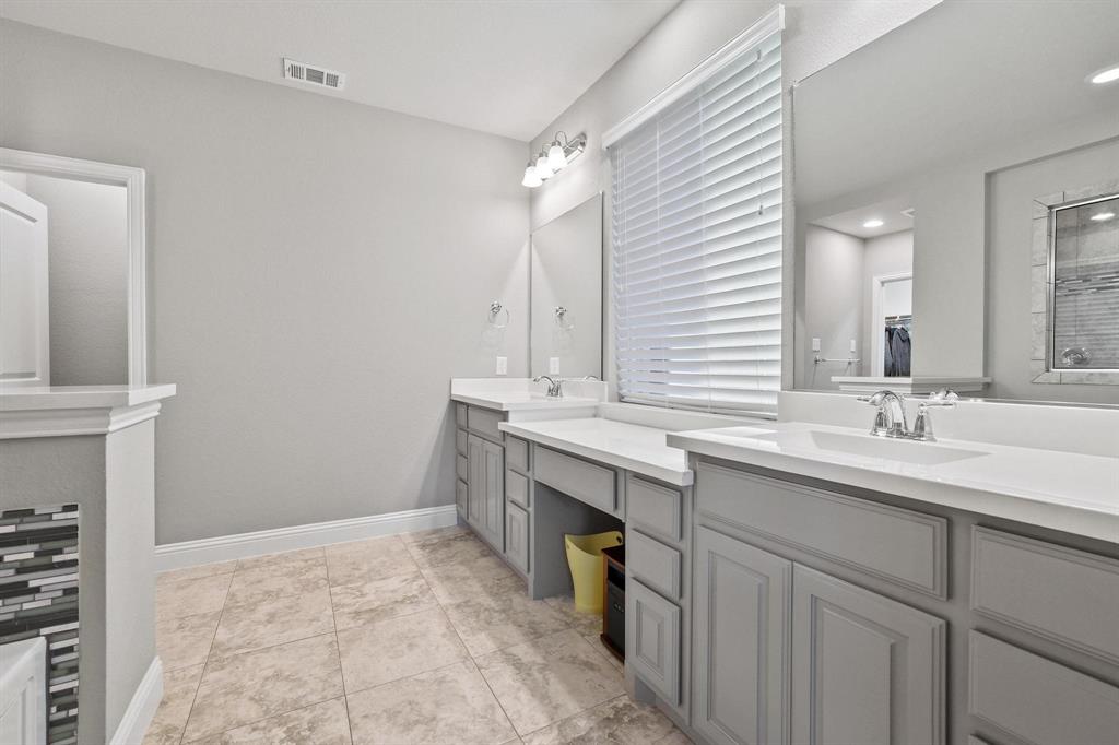3500 Jersey Road Melissa, TX 75454 - Photo 16 of 40 a bathroom with a sink double vanity and a mirror