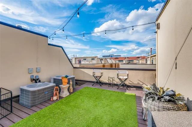 a view of a chairs and table in patio