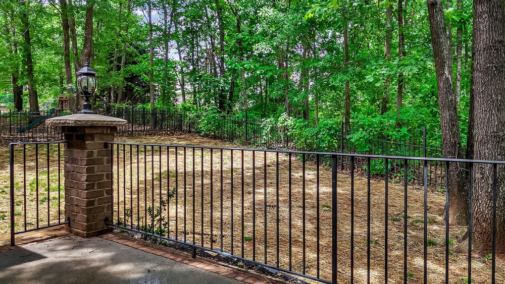 109 Limelight Drive Anderson, SC 29621 - Photo 14 of 34 This tranquil backyard retreat features lush greenery and a classic fence perfect for security of pets
