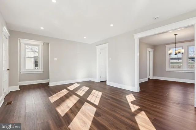 a view of livingroom with hardwood floor and hallway