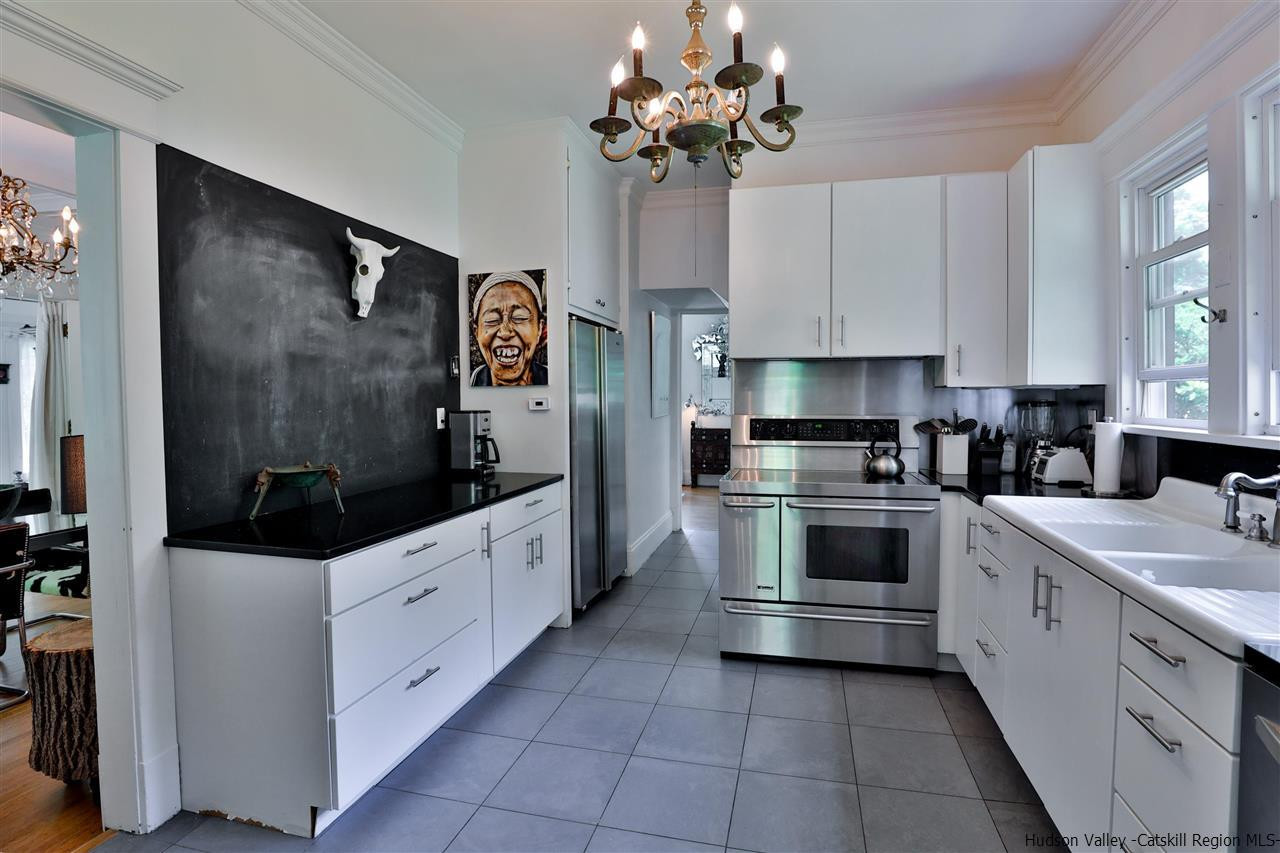 455 Main Street Fleischmanns, NY 12430 - Photo 17 of 35 a kitchen with stainless steel appliances a white stove top oven and cabinets