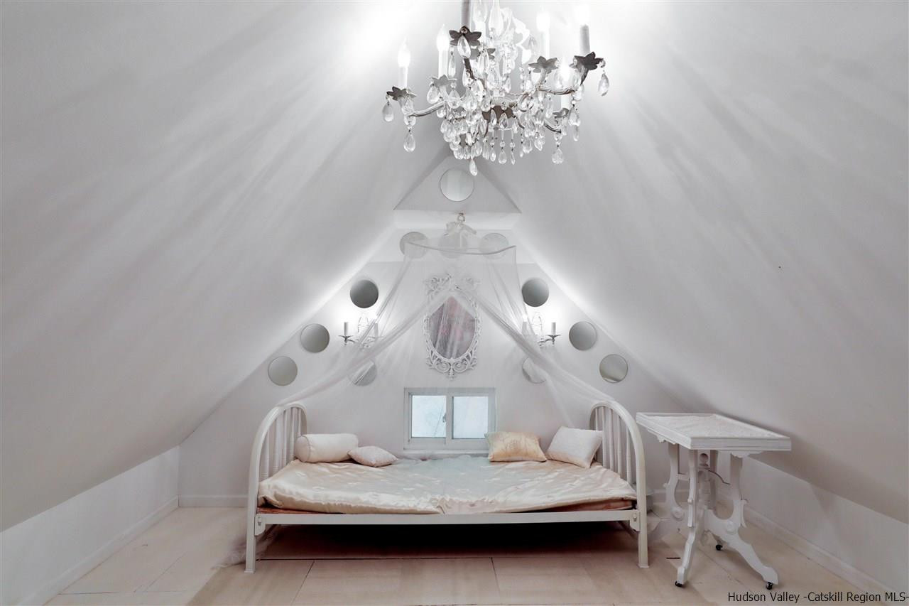 455 Main Street Fleischmanns, NY 12430 - Photo 26 of 35 a bedroom with a bed and a chandelier