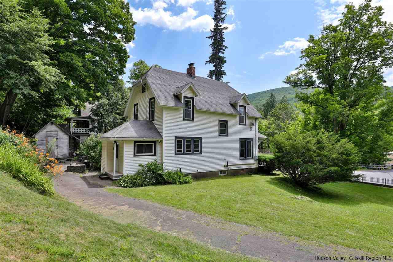 455 Main Street Fleischmanns, NY 12430 - Photo 3 of 35 a front view of a house with a yard and trees