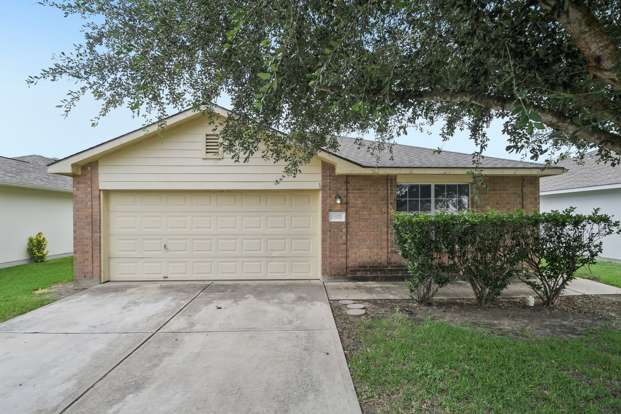 610 Lavaca Loop Elgin, TX 78621 - Photo 1 of 37 A well-maintained single-story home with an attached garage and mature landscaping welcomes you.