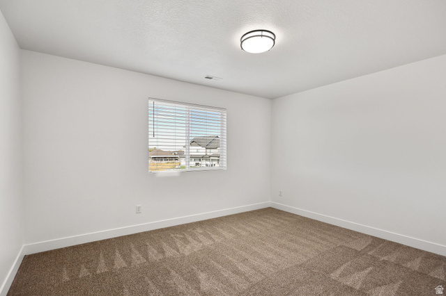 1661 West Ross Road Syracuse, UT 84075 - Photo 20 of 28 Empty room featuring baseboards and carpet floors
