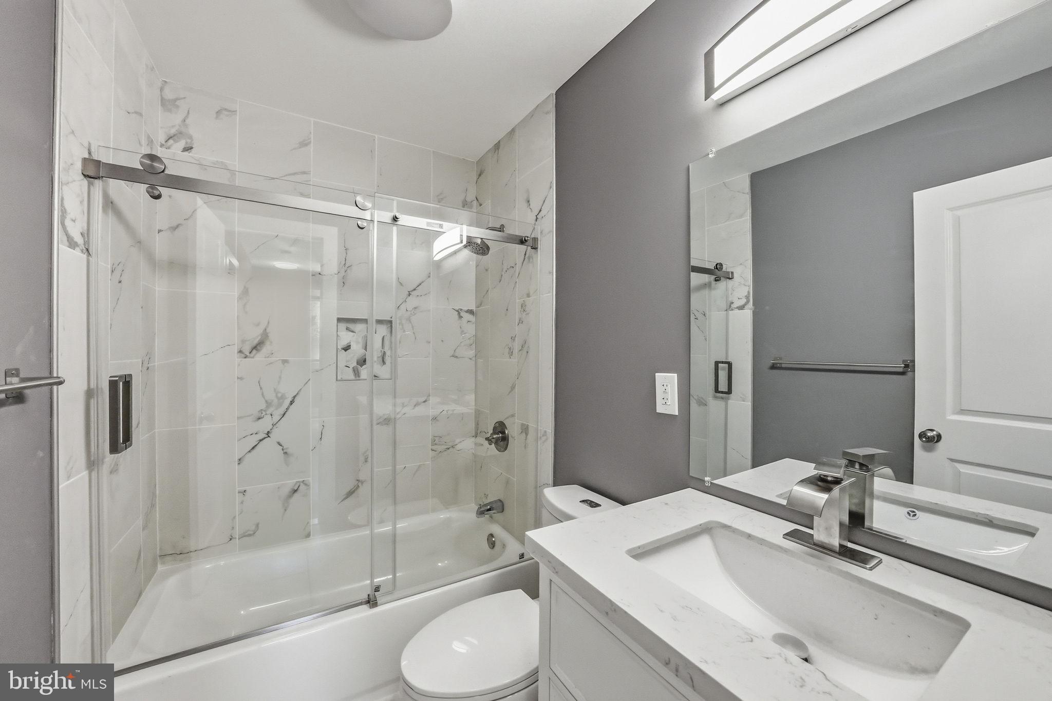 371 Bolton Road East Windsor, NJ 08520 - Photo 15 of 20 a bathroom with a sink toilet tub and shower