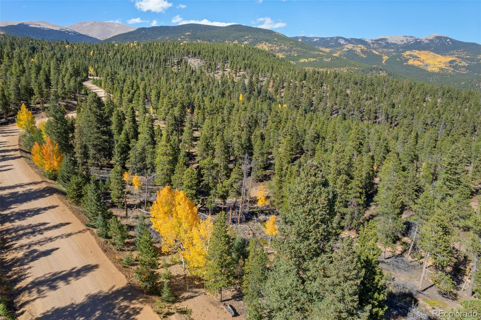 1001 Royal Ridge Drive Bailey, CO 80421 - Photo 11 of 25 a view of a city with mountains in the background