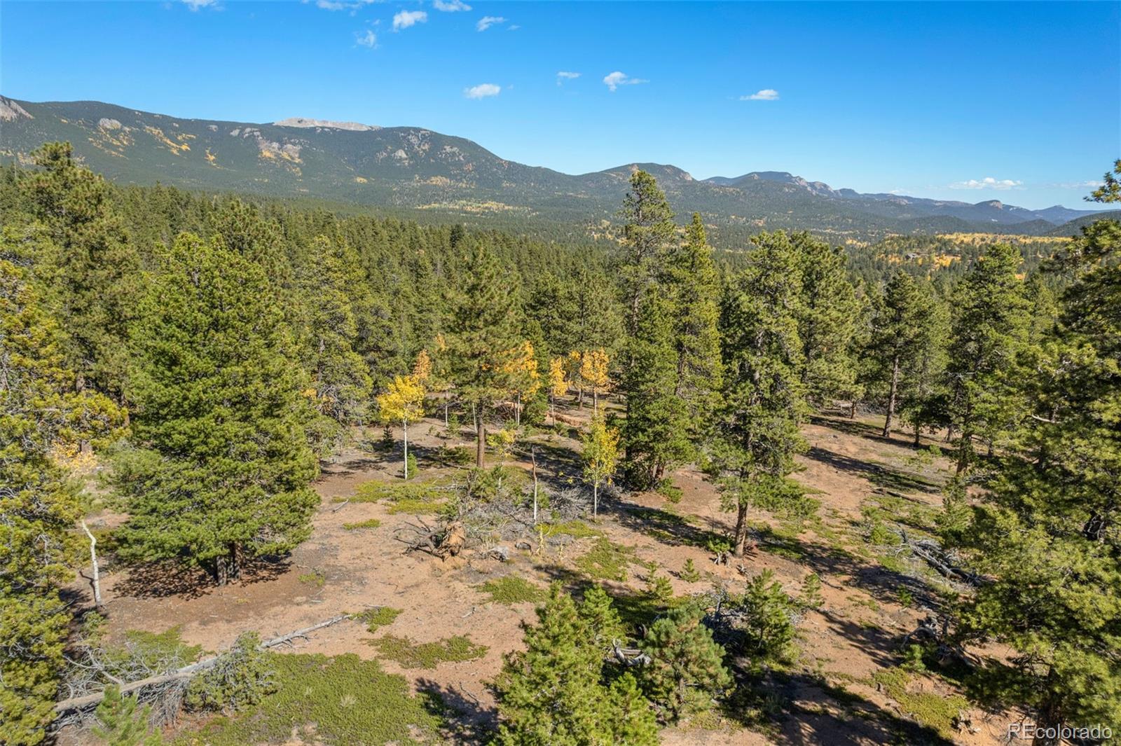 1001 Royal Ridge Drive Bailey, CO 80421 - Photo 9 of 25 a view of a mountain view with mountains in the background