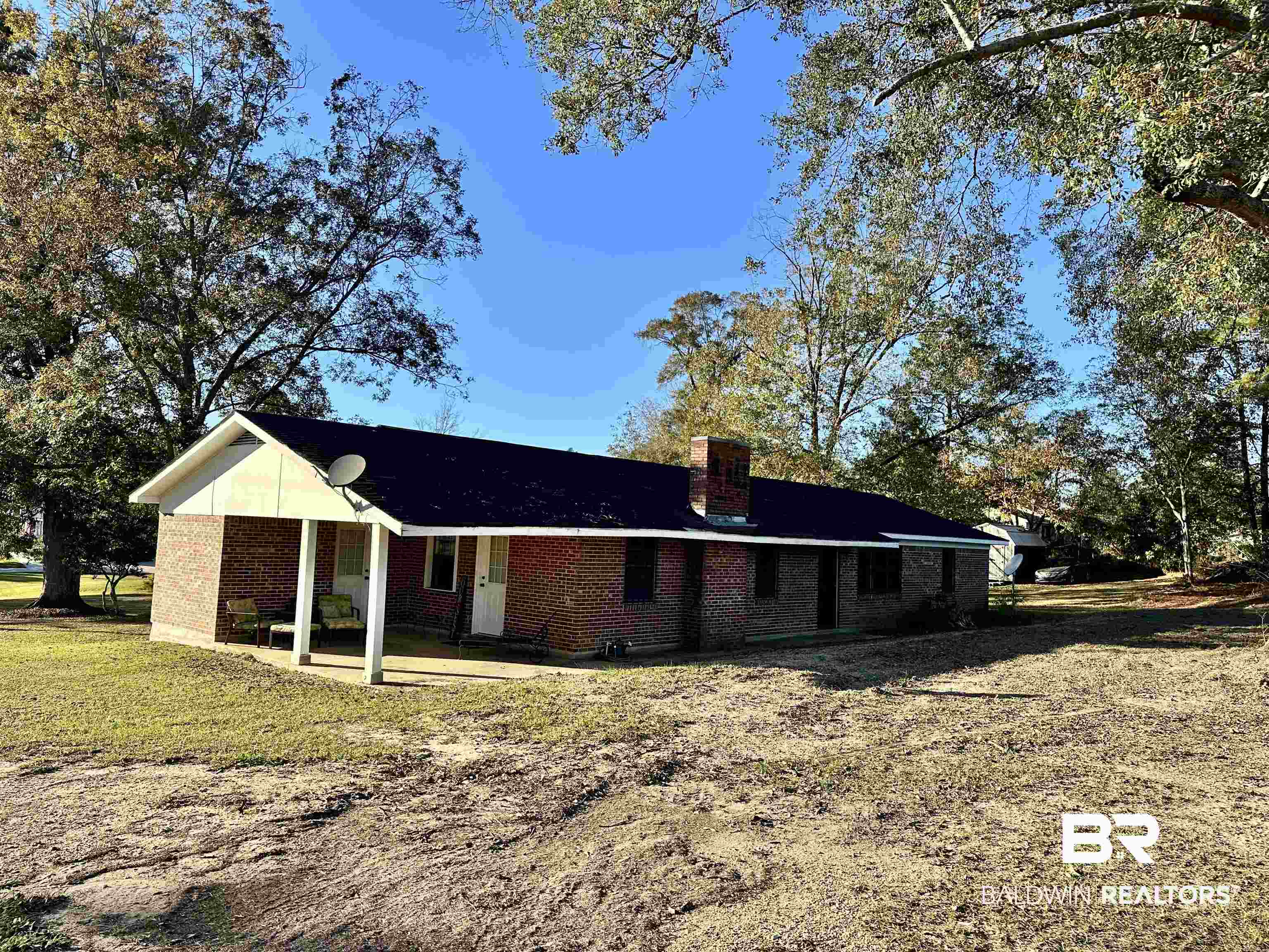 View of front of house featuring a front yard and a patio area