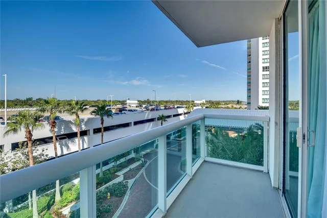 a bedroom with a bed furniture and a flat screen tv